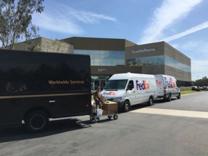 Delivery trucks line up each day at ScanMyPhotos.com in Irvine, CA