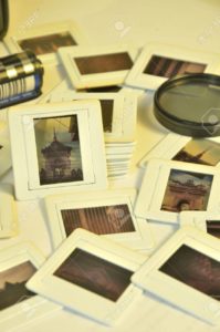 Pile of photo film slides with plastic frames of memories in vintage color style